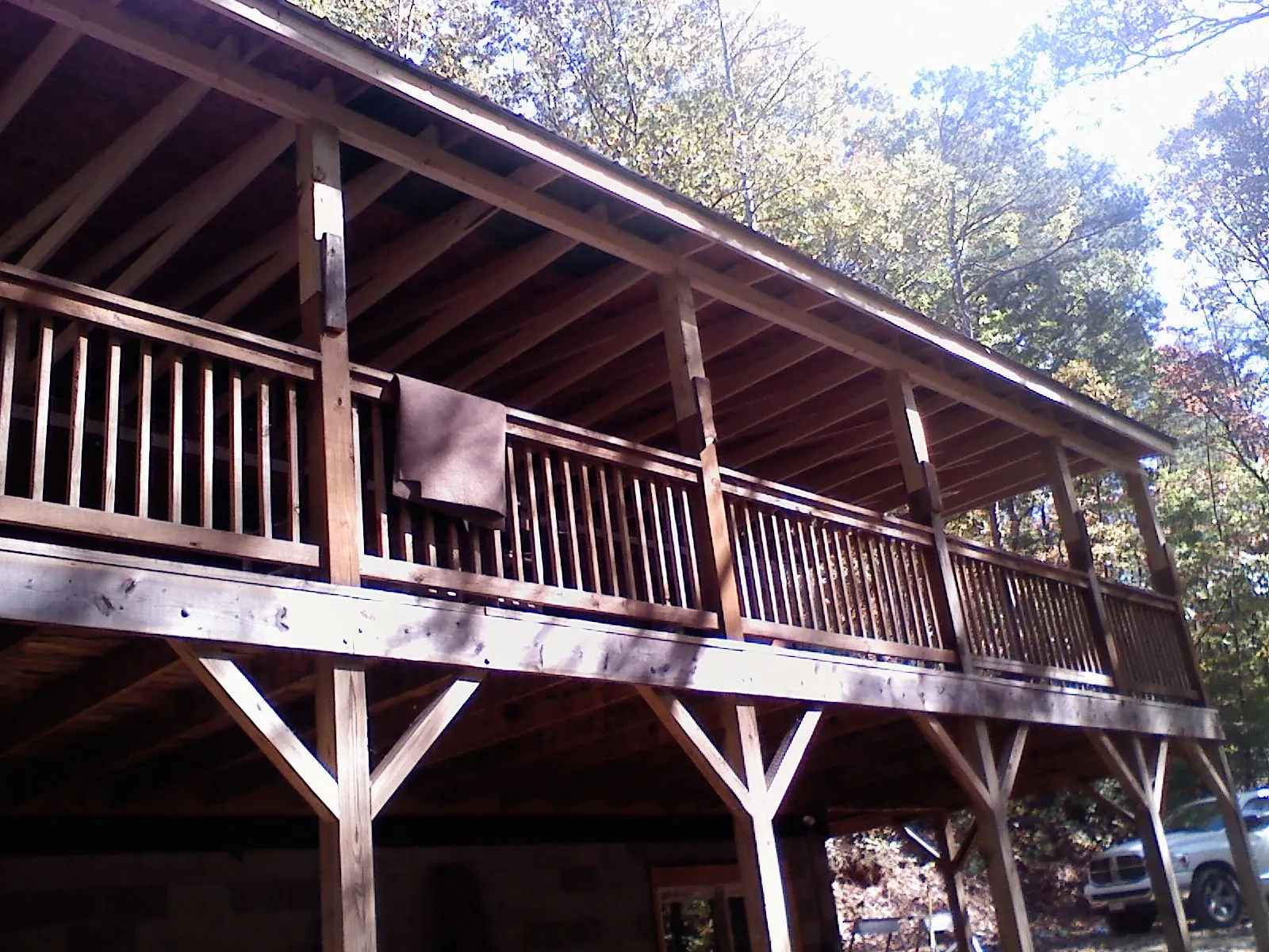 Timber framing under a new elevated porch and deck — Roof Leak Repair in Oswego by Roofing Brothers